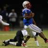 Photo: Liberty running back Niko Kapeli spins away from P Photo: Liberty running back Niko Kapeli spins away from P